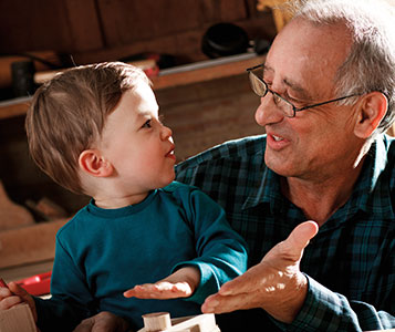 Grandfather and grandson playing. Links to Gifts by Estate Note