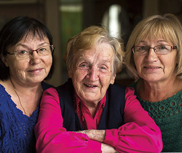 Elderly mother with her daughters. Links to Gifts of Cash, Checks, and Credit Cards